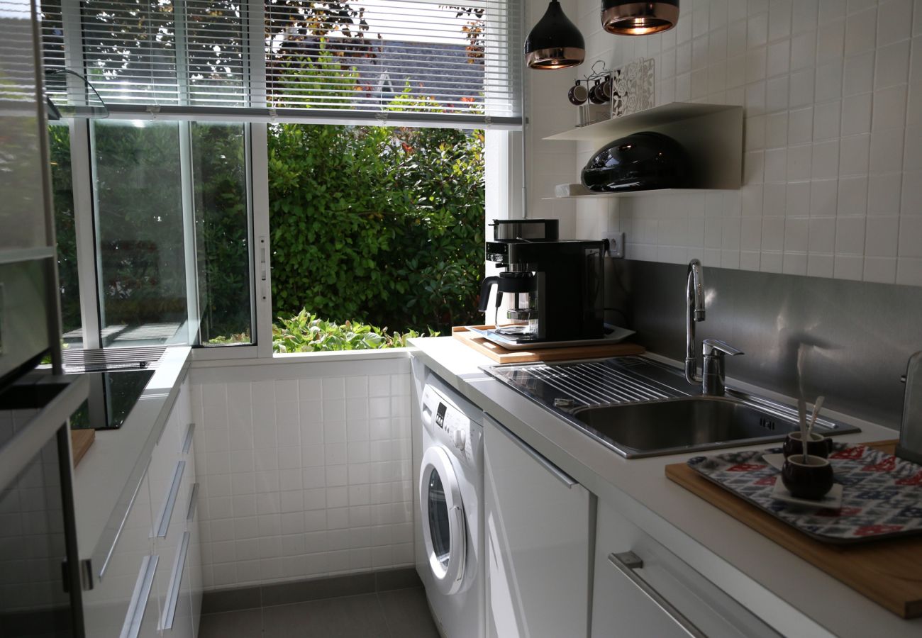 Fully equipped separate kitchen with large picture windows in Saint Malo