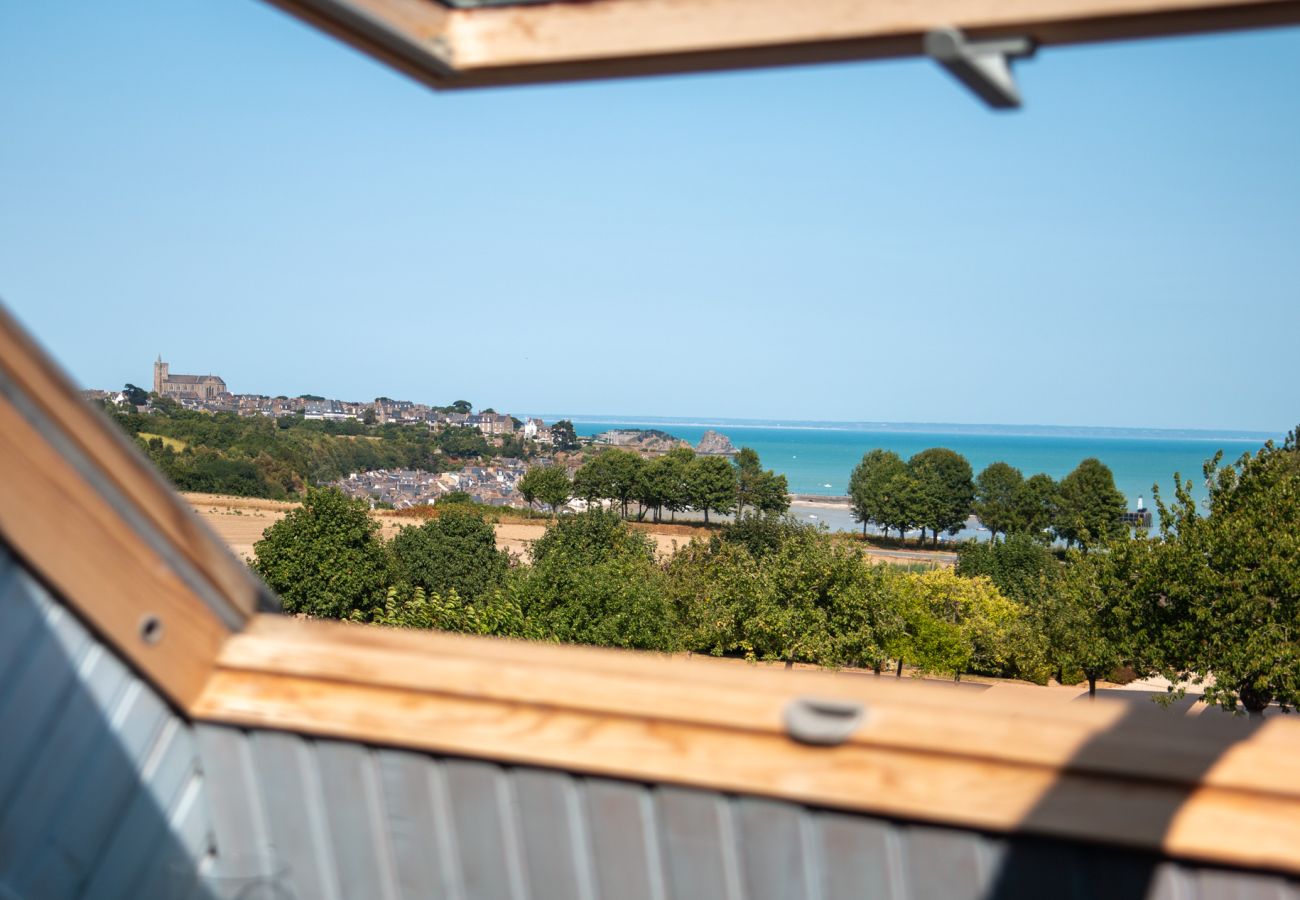 Panoramic view from the bedroom of Cancale, the Bay of Mont-Saint-Michel and the sea through the skylight